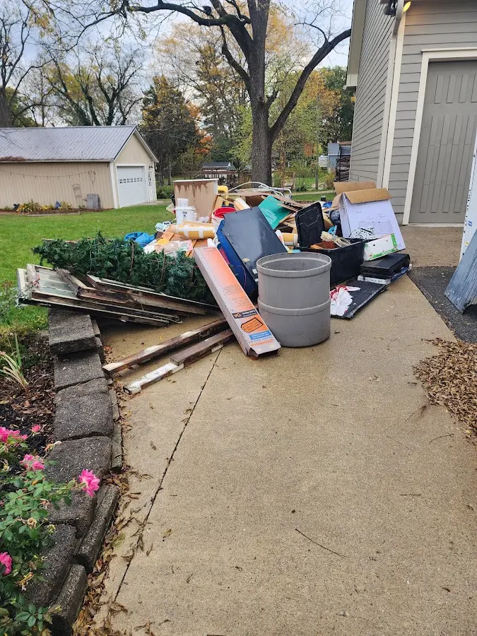 Dumpster being loaded with debris for Estate Cleanout Dumpster Rental in Summerlin South
